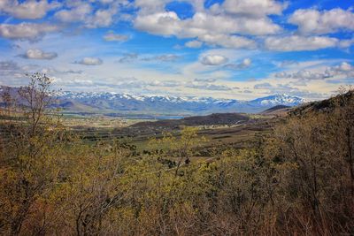 Scenic view of mountains against cloudy sky