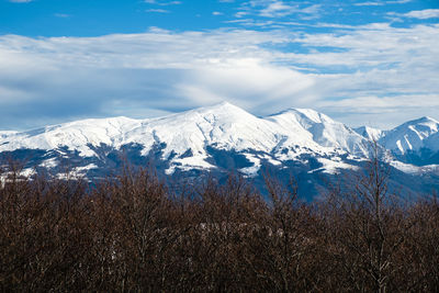 Scenic view of snowcapped mountains against sky in accumoli, lazio italy 