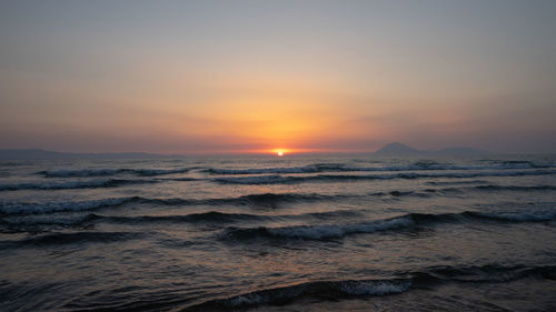 Scenic view of sea against sky during sunset