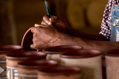 Close-up of man working in clay