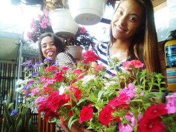 Portrait of smiling girl with flowers