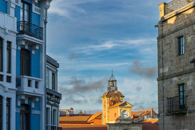 Buildings in city against sky