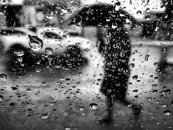 Full frame shot of wet glass window in rainy season