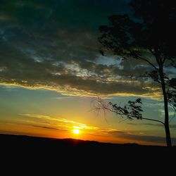 Scenic view of silhouette landscape against sky during sunset