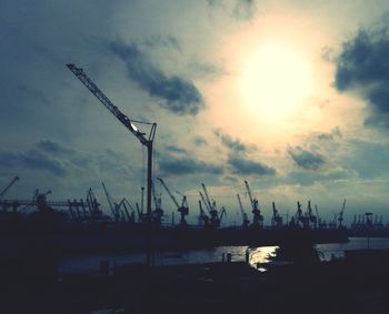 Silhouette of cranes at commercial dock