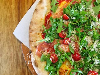 Close-up of pizza served on table