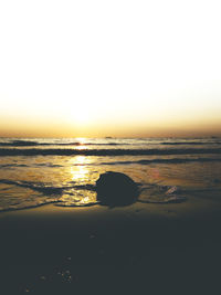 Scenic view of sea against clear sky during sunset