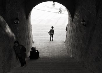 People walking in tunnel