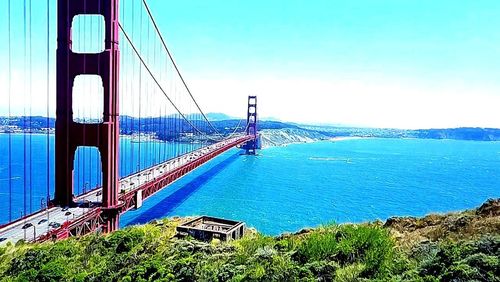 View of suspension bridge over sea