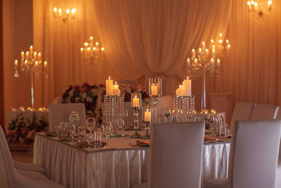 Panoramic view of illuminated glasses on table