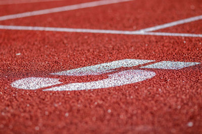 Close-up of number 5 on sports track