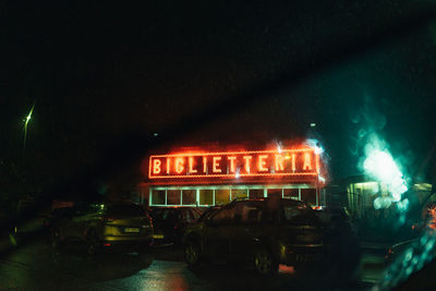 Illuminated street light in city at night