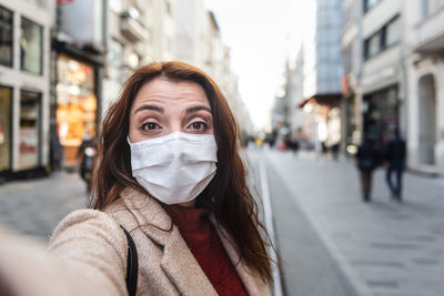 Portrait of woman on city street