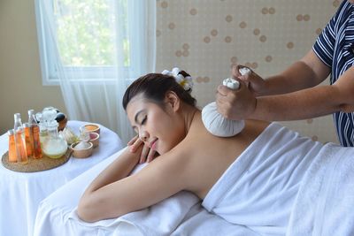 Woman lying down on bed