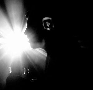 Close-up of woman in illuminated room