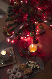 Close-up of illuminated christmas tree on table