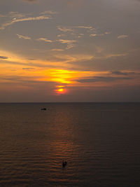 Scenic view of sea at sunset