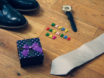 High angle view of shoes on wooden table