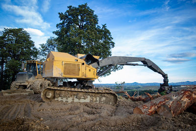 Construction site by road against sky