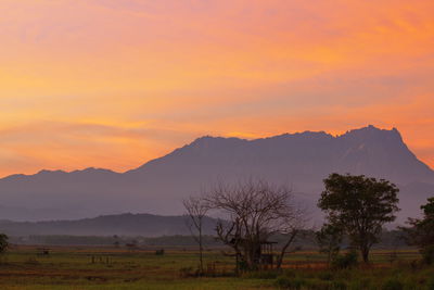 Scenic view of mountains against sky during sunset