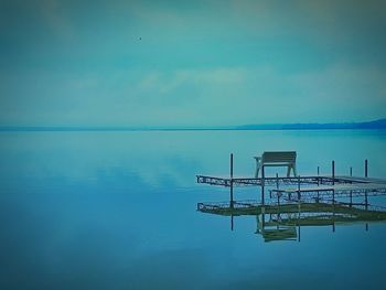 Scenic view of calm sea against blue sky