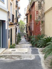 Narrow alley amidst buildings in city