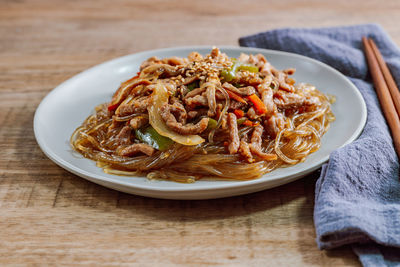 Close-up of noodles served on table