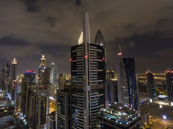 Illuminated buildings in city at night