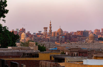 Buildings in city against sky