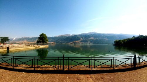 Scenic view of lake against blue sky