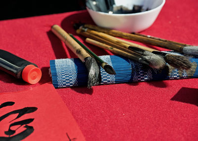 High angle view of paintbrushes on table