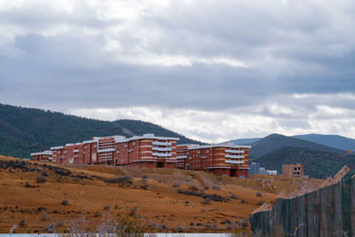 Buildings in city against sky