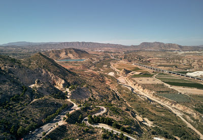 High angle view of land against clear sky