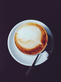 Close-up of coffee cup on table