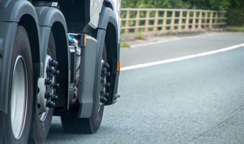 Close-up of vintage car on road