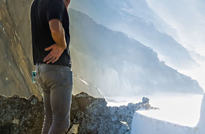 Man standing on snowcapped mountain