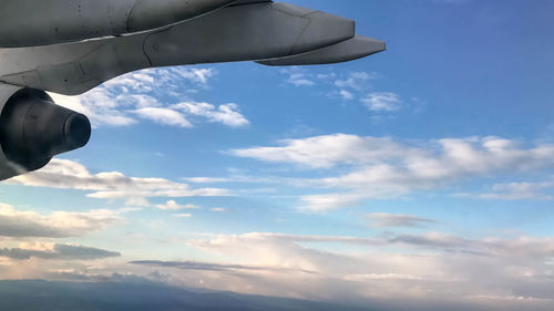 Low angle view of airplane flying in sky