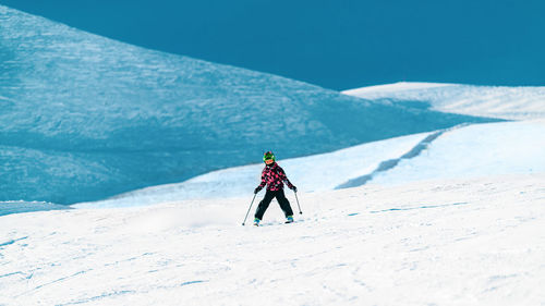 Boy skiing in the mountains