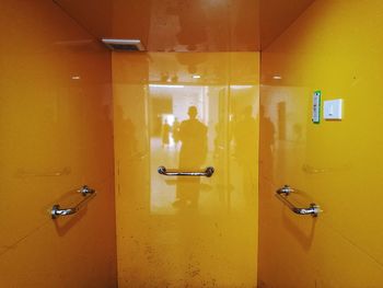 View of people on yellow door