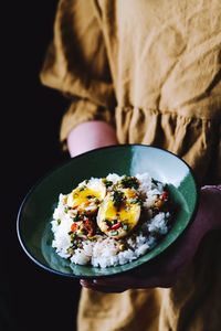 Close-up of woman holding food