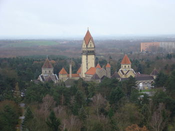 High angle view of trees and buildings against sky