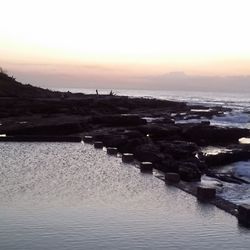 Scenic view of sea against clear sky during sunset