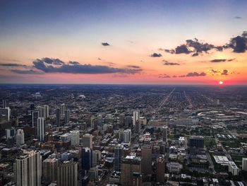 High angle view of city at sunset