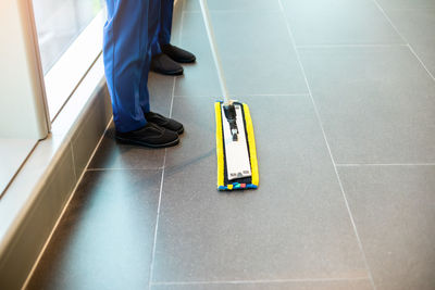 Low section of man walking on floor