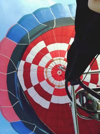 Low section of person standing on hot air balloon