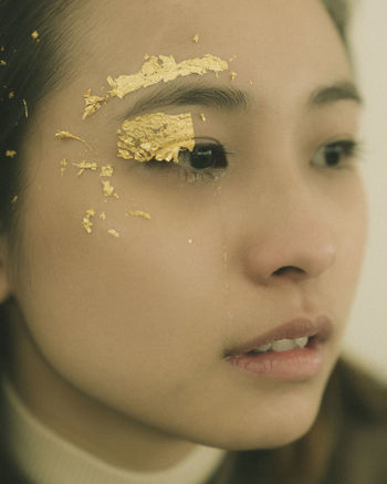 Close-up of sad young woman looking away