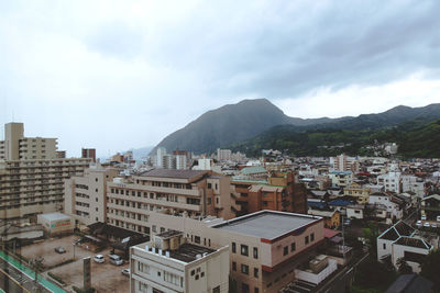 High angle view of townscape against sky. beppu, japan