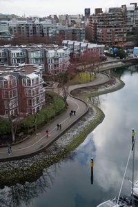 High angle view of river by buildings in city