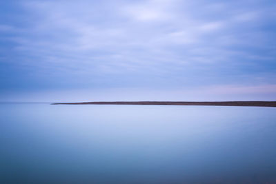 Scenic view of sea against sky at dusk