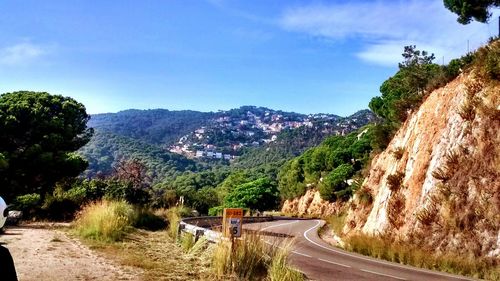 Country road leading towards mountains